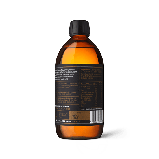 ANCIENT + BRAVE amber glass bottle containing their True MCT Oil made from ethically sourced coconut oil showing the back label of the bottle